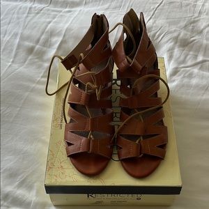 Restricted strap heel sandal